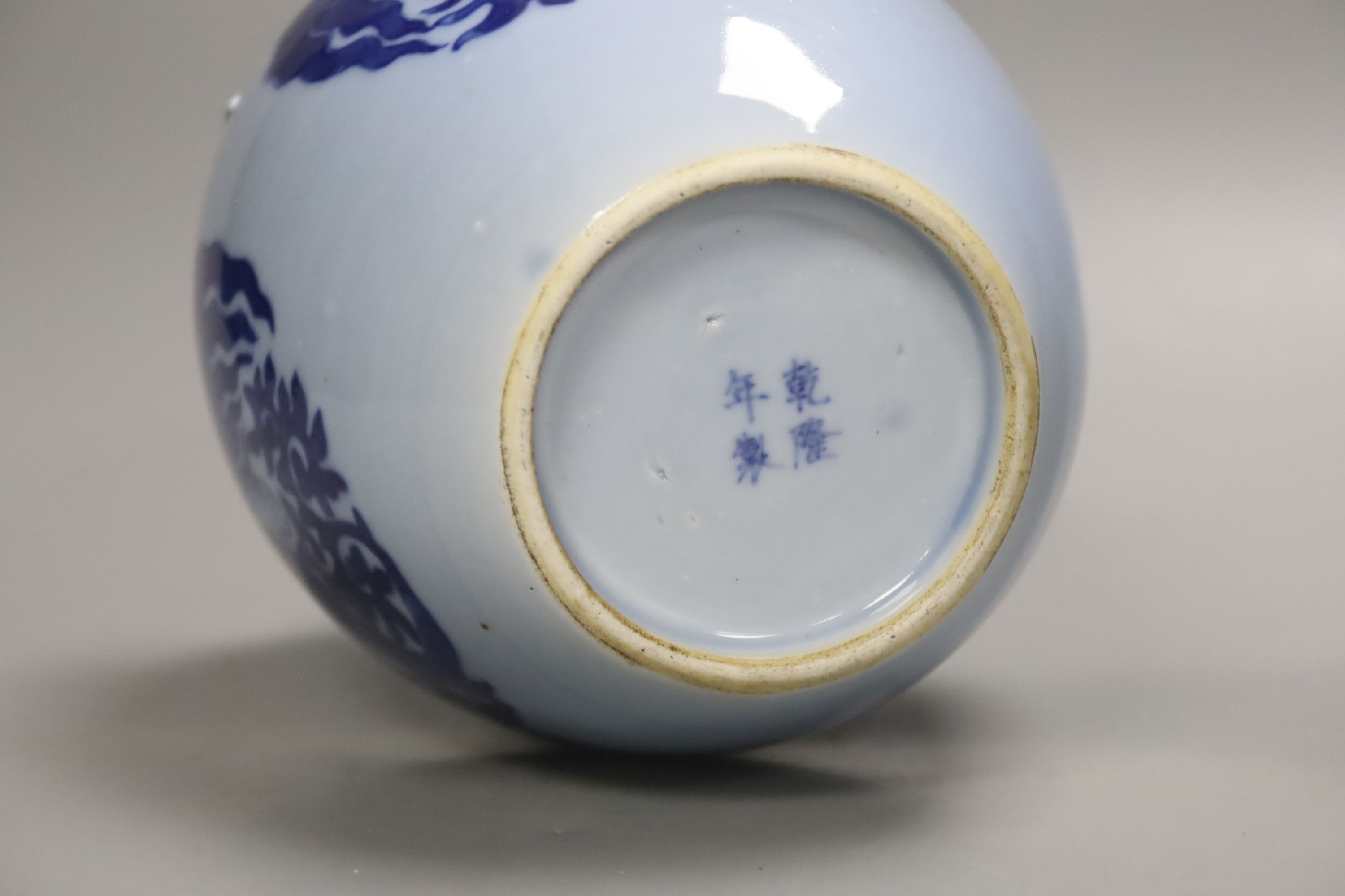 A Chinese blue ground blue and white dragon design vase, 17cm high